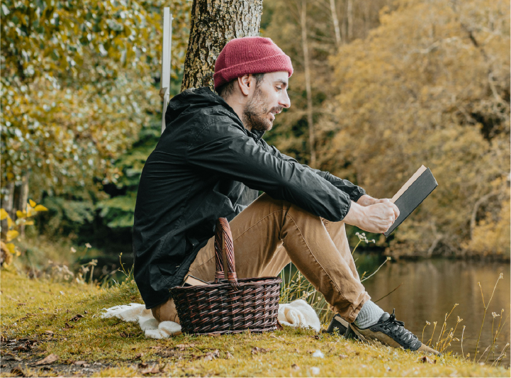 man reading outdoors
